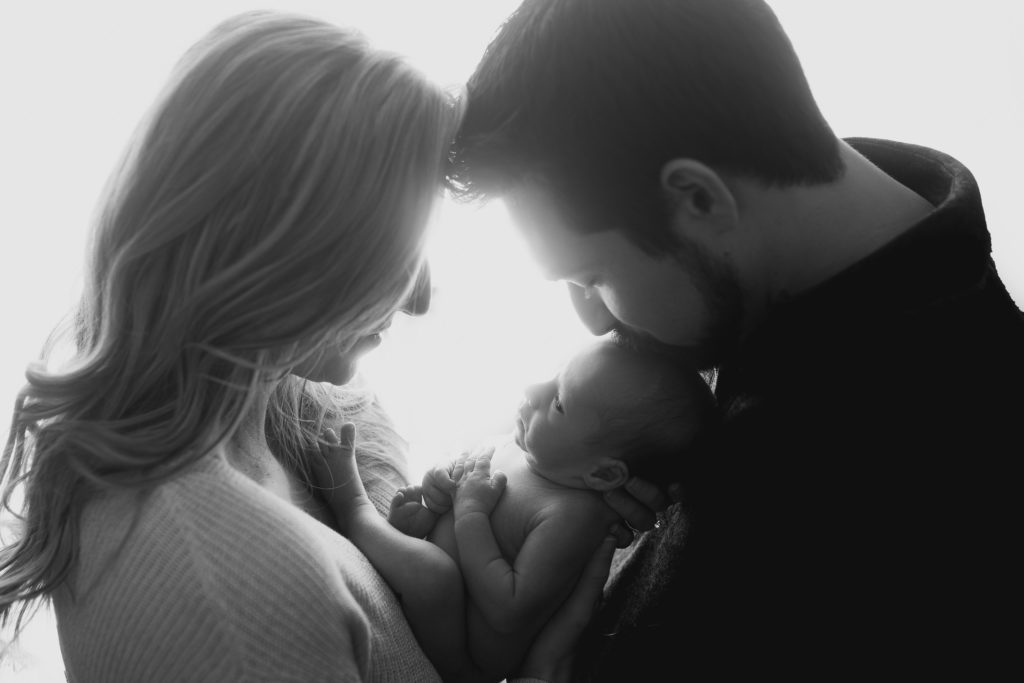 backlit newborn family photoshoot