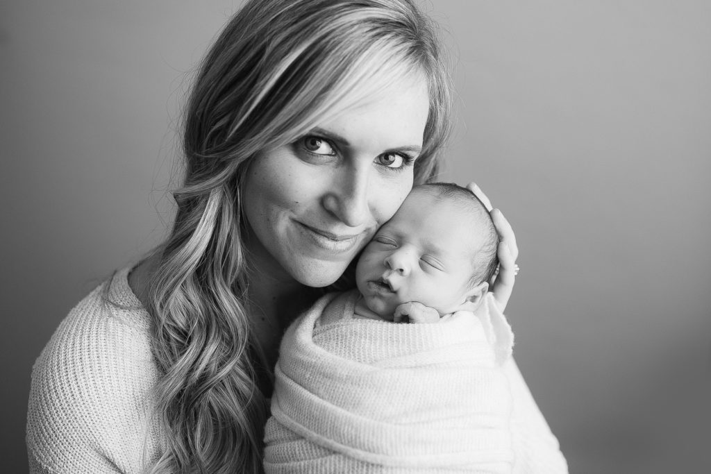 black and white photo of newborn baby and mom