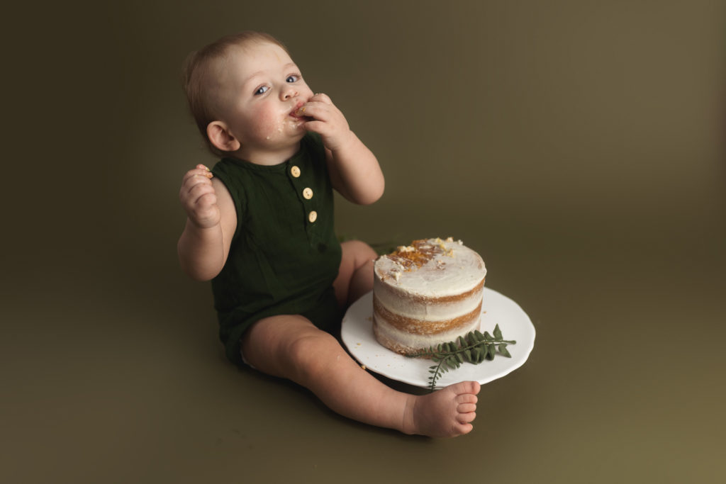 baby boy with cake 1st birthday photoshoot