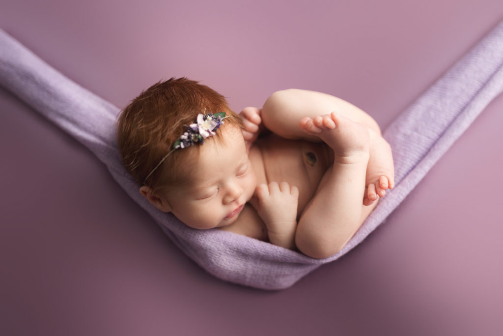 newborn baby hammock pose purple