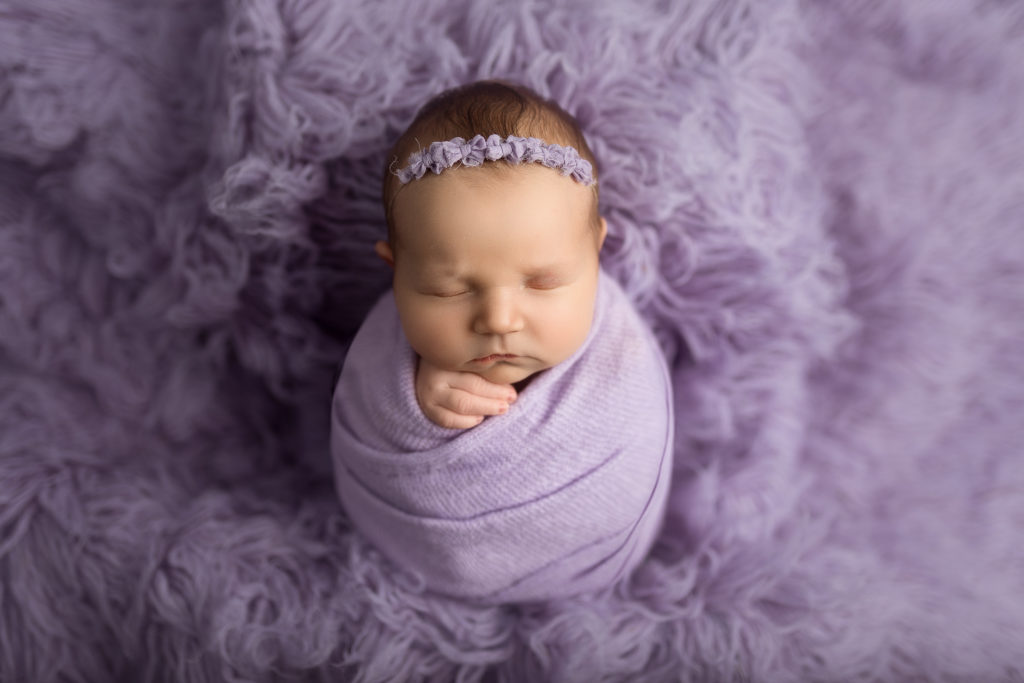 baby on purple flokati fur