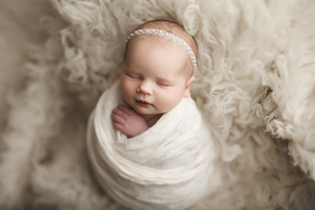 newborn baby on all white
